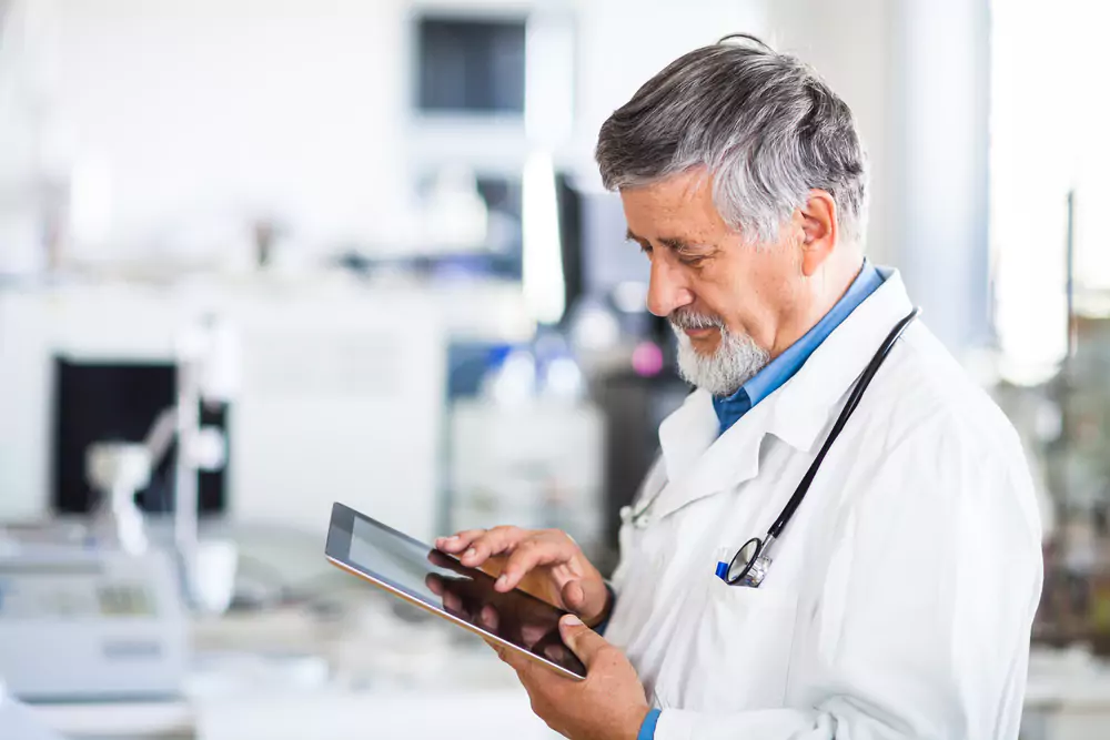 Doctor accessing PACS on tablet
