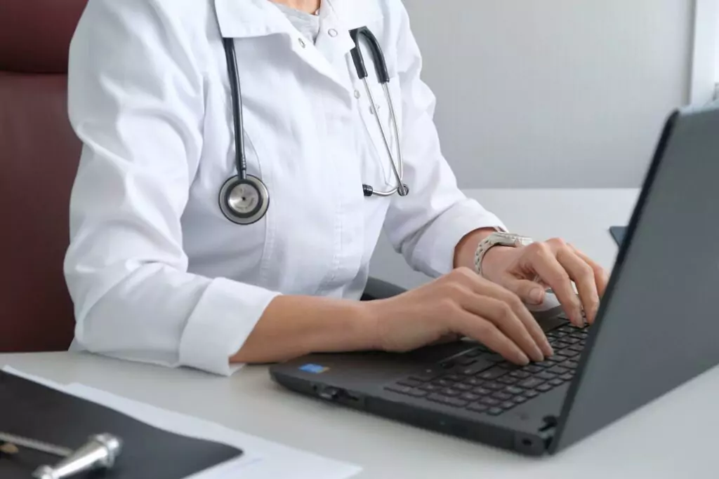 Medical professional reviewing reports