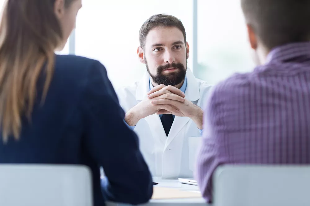 Healthcare professionals discussing data migration strategies, representing secure and efficient transfer of medical imaging